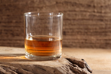 scotch whiskey in glass on a wooden table with a blank space for a text, scotch whiskey in rustic bar background