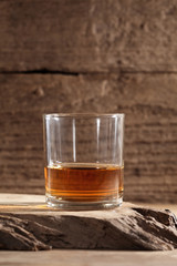 scotch whiskey in glass on a wooden table with a blank space for a text, scotch whiskey in rustic bar background