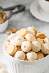 Butter cookies in a white vase on a light gray background