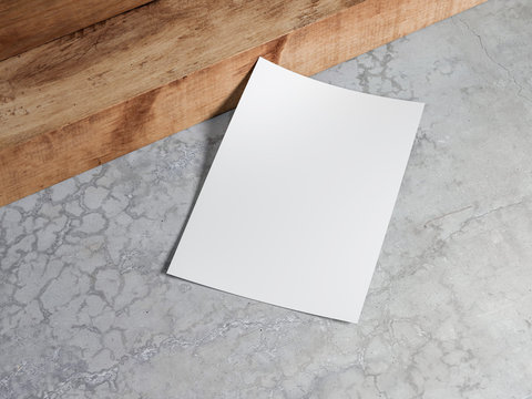 White vertical paper sheet Mockup lying on a concrete floor