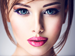 Attractive young woman with beautiful big blue eyes.