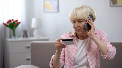 Aged woman calling children asking for help with using banking card, generation