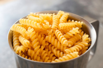 Fusili pasta in stainless container