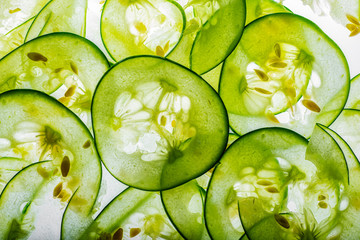 sliced cucumbers close up © Vera Kuttelvaserova