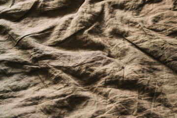 Crumpled brown natural linen fabric