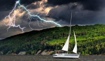 Sailboat in the storm sea.Yacht and beautiful seascape.Travel on a sailing boat.s.