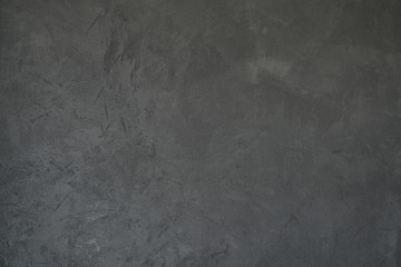 texture of dark gray wall with decorative plaster concrete effect