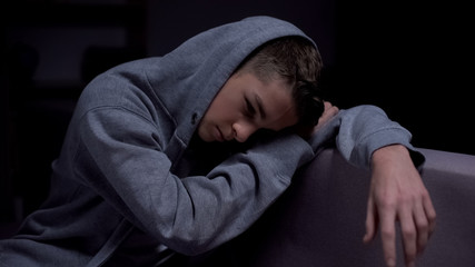 Fototapeta premium Drug addicted teenager suffering withdrawal, psychological rehabilitation, help