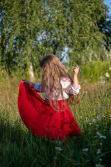 girl dancing in a red dress