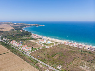 Aerial photo of the beautiful small town and seaside resort of known as Obzor in Bulgaria taken with a drone on a bright sunny day showing the hotels and fields of the holiday resort