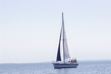 Fototapeta na wymiar Sailing ship yachts with white sails in a row