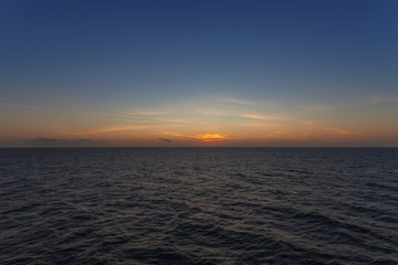 Fototapeta na wymiar Colorful sky right after sunset behind the italian coast