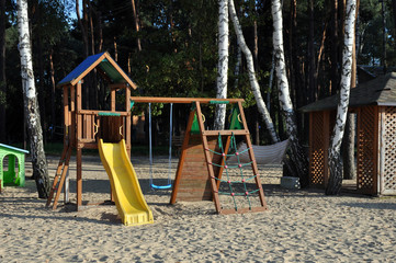 Fototapeta na wymiar a children's playground set on a public beach.
