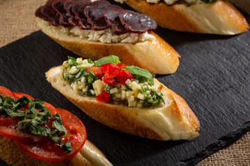 Italian bruschetta set on slate close-up