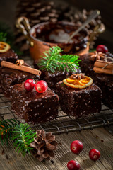 Fototapeta na wymiar Delicious Gingerbread cubes for Christmas with ingredients