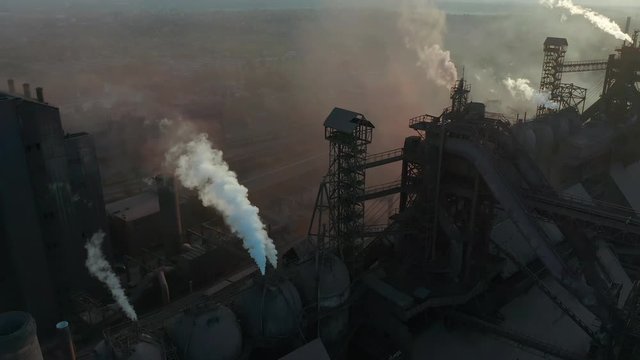 Aerial view. Pipes Throwing Smoke in the Sky. Environmental pollution concept danger to planet earth.