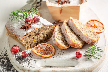 Delicious poppy seed cake for Christmas decorated with spruce