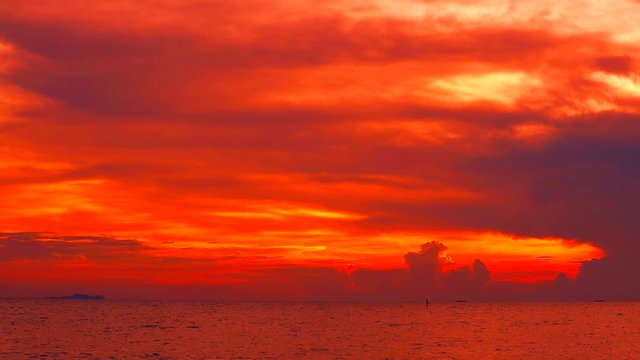 red sunset red dark red sky and cloud moving on sea