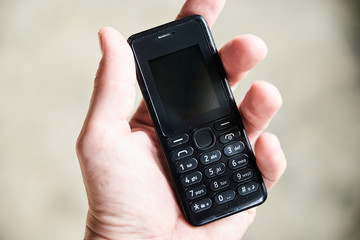 hand with mobile phone isolated on white background