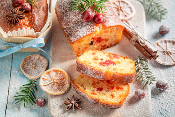 Obraz na płótnie Canvas Tasty Fruitcake for Christmas baked in a wooden mold