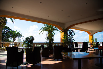 Hotel bar with palm trees and beautiful view