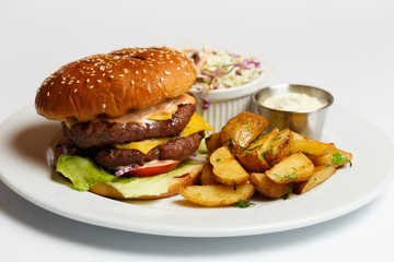 burger with double pork chop and baked potatoes
