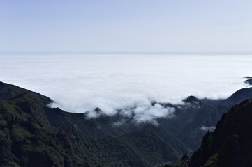 Fototapeta na wymiar Panoramic view above clouds on 'Pico do Arieiro' (Sandbox Peak) and 'Pico Ruivo' (Redhead Peak) mountains (Madeira, Portugal)