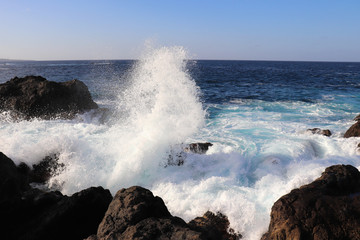 Fototapeta premium Water splashing into the air in Garachico, Spain