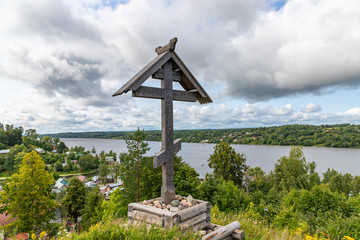 Fototapeta na wymiar PLYOS / RUSSIA - AUGUST 4, 2019: Old Russian cemetery on top of a hill in ancient town Plyos, standing on the banks of the Volga River.