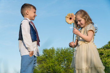  child gives flowers. beautiful children