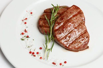 beef rib eye on a white plate