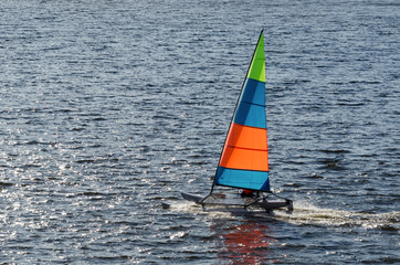 HOLIDAY ADVENTURES ON THE YACHT  - The catamaran floats on the lake in the sunshine