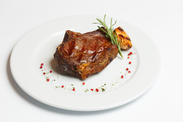 beef rib eye on a white plate