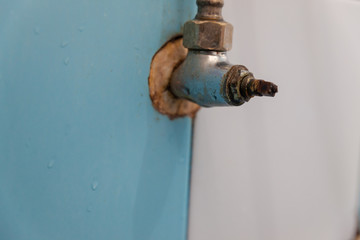 Old rusty water tap in Bathroom. Faucet water. Rust stains on the water valve.