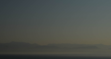 dusk shot of mountains in the distance