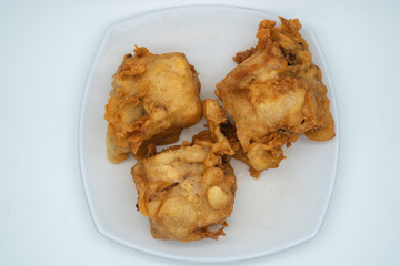 Fried tofu with vegetable stuffing, popular type of snack in southeast asia especially Indonesia and Malaysia, known locally as tahu isi. Shot isolated on white background