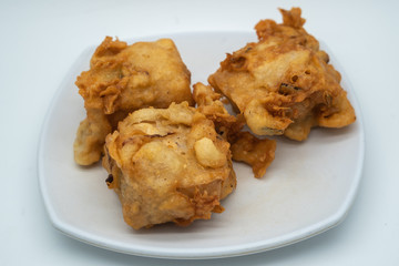 Fried tofu with vegetable stuffing, popular type of snack in southeast asia especially Indonesia and Malaysia, known locally as tahu isi. Shot isolated on white background