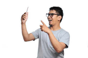 Excited expression on front of a smartphone. Portrait of happy asian person very excited when get the best price at online store