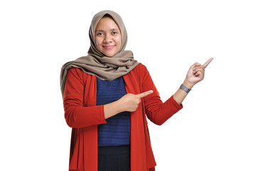 Excited expression of happy smiling asian woman pointing of a copyspace