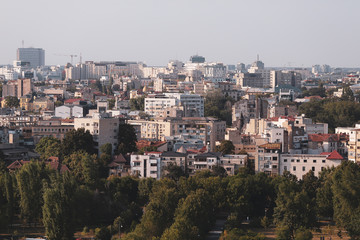 Cityscape of old part of Bucharest, with many worn out buildings, as seen from the Palace of Parliament
