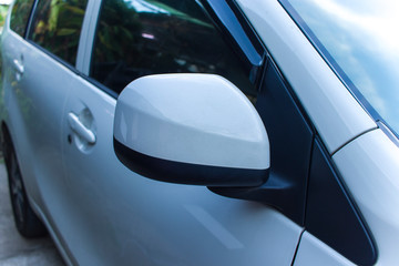 Car Rear View Mirrors parked on the nature of different colors from different angles