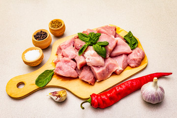 Raw pork neck, cut into pieces with fresh vegetables and dry spice