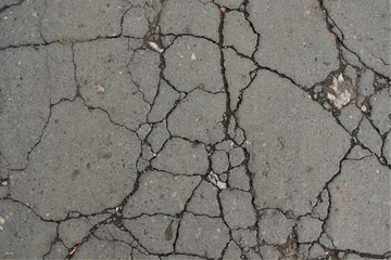 many cracks on the pavement