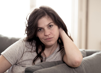 Beautiful lifestyle portrait of young woman happy and relaxed at home