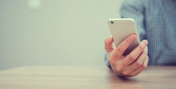 close up on man play on smartphone concept	