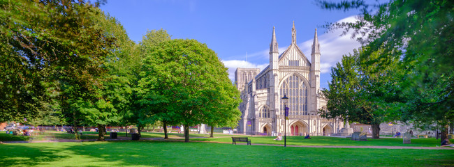 Autumn afternoon light on the West Front of Winchester Cathedral, UK - obrazy, fototapety, plakaty