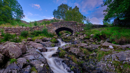 Fototapeta na wymiar Ashness Bridge near Watendlath with streams from heavy August rains, Lake District National Park