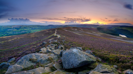 Heather and sunset over the Hope Valley from Win Hill in the Peak District National Park