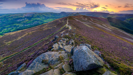 Heather and sunset over the Hope Valley from Win Hill in the Peak District National Park
