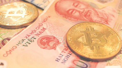 Close up the Vietnamese Dong Banknotes and Bitcoin